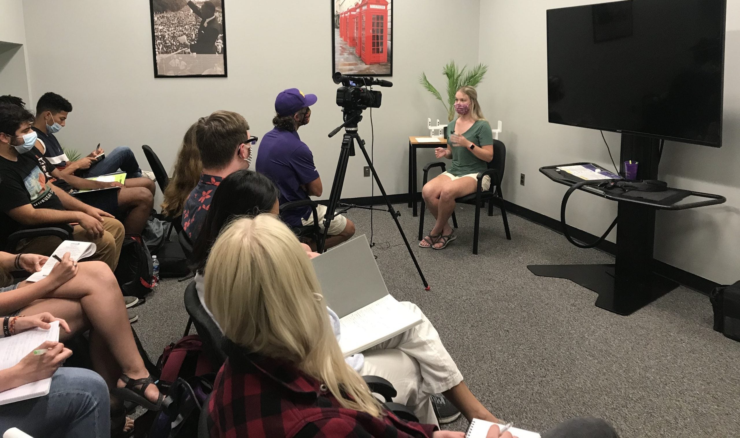 A student presents her research to her peers and Rich Klindworth, our colleague from ECU News Services